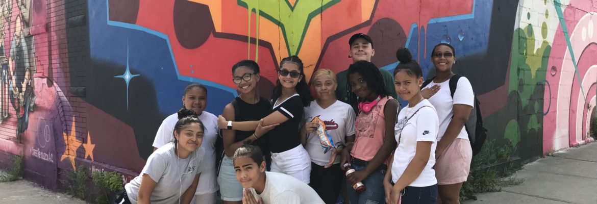 Graffiti youth pose for a photo